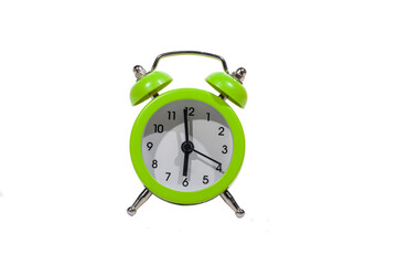 Small green analog alarm clock isolated on white background