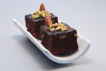 Brownie with almond and pistachio nut toppings