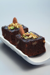 Brownie with almond and pistachio nut toppings