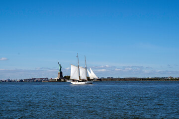 Statue of Liberty and yacht, New York City, NY, USA