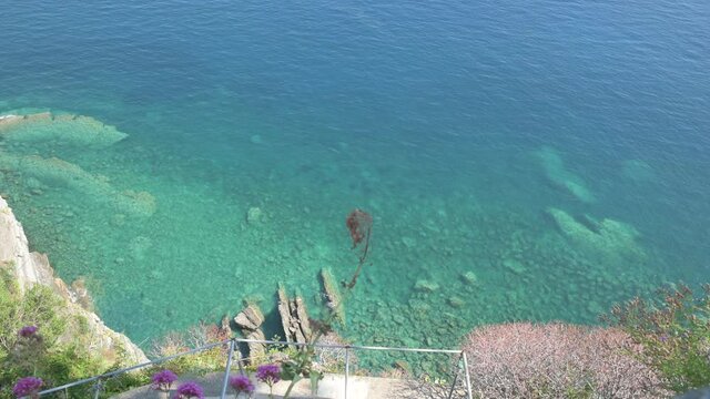 Corniglia, Liguria, Italy. June 2020. Beautiful view from the top of the belvedere of the village: sea with crystal clear waters on a beautiful sunny day.