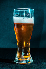 Glass of beer with dark background