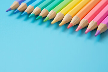 Colorful Pattern of  Pastel colored pencils on blue background and copy space