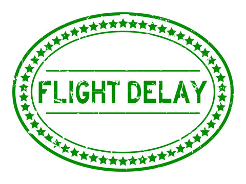 Grunge green flight delay word oval rubber seal stamp on white background