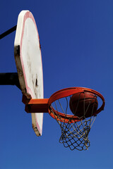 A ball going into the hoop