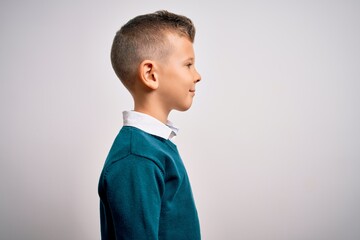Young little caucasian kid with blue eyes standing wearing elegant clothes over isolated background...