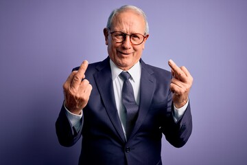 Grey haired senior business man wearing glasses and elegant suit and tie over purple background...