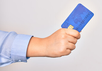 Hand of caucasian young woman holding credit card over isolated white background