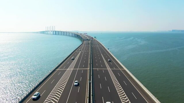 Qingdao Jiaozhou Bay Cross-sea Bridge，The Jiaozhou Bay Bridge starts from the Bay Bridge Interchange in the east, crosses the Jiaozhou Bay