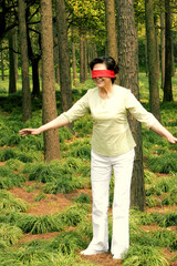 A blindfolded woman trying to find her way