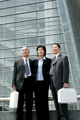 Fototapeta premium Businessmen and woman standing in a row