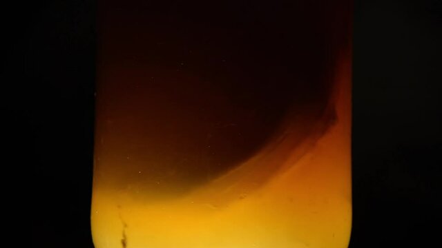Fast swirling Kombucha scoby moving in a jar