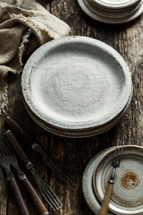 Set of modern ceramic tableware on a wooden table