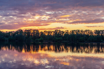 Twilight over the river and forest. Landscape of the middle plain of Russia.