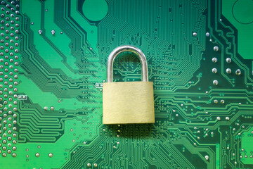 Master key or Gold Padlock on electronic motherboards background.