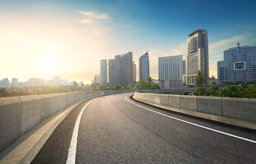 Fototapeta na wymiar Highway overpass motion blur effect with modern city background.