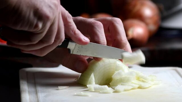 Chopping an onion, close shot