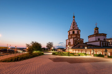 Russia, Irkutsk - June 30, 2020: The Cathedral of the Epiphany of the Lord. Orthodox Church, Catholic Church in sunset with paving