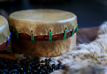Hand-made Native American shaman drum made of buffalo hide with beads and fur