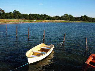 Obraz premium Small fishing dingy boat in a harbour at Funen Denmark