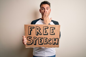 Young handsome man asking for rights holding banner with free speech message cover mouth with hand shocked with shame for mistake, expression of fear, scared in silence, secret concept