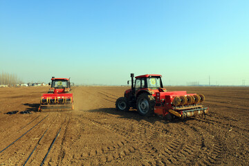 Obraz premium Rotary tiller planters grow peas on farms, Luannan County, Hebei Province, China