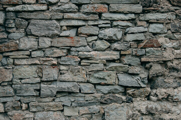 An old stone medieval wall, a natural background, a replica of the cosmos.