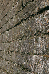 An old stone medieval wall, a natural background, a replica of the cosmos.