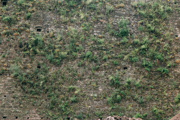 An old stone medieval wall, a natural background, a replica of the cosmos.