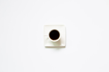 Cup of coffee on white background. top view