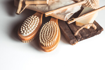 Natural brushes made of wood and soap on the background of concrete, bamboo toothbrushes PNOV2019
