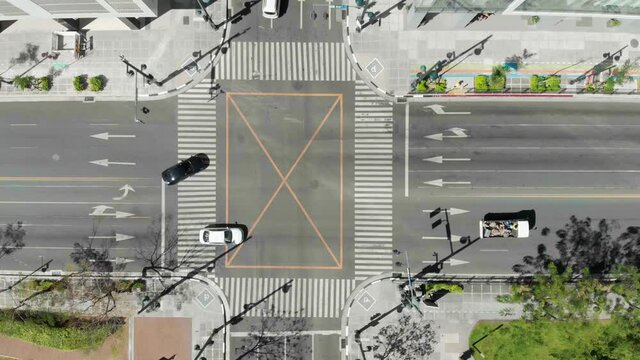 View from above. Cars are driving on empty streets of BGC during the quarantine in Manila, Philippines. Taguig, Bonifacio Global City.