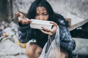 poor people,homeless or beggar begging for help sitting at dirty slum.concept for poverty...