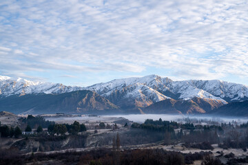 Panorama of Snow Mountain Range Landscape with Blue Sky background from New Zealand.