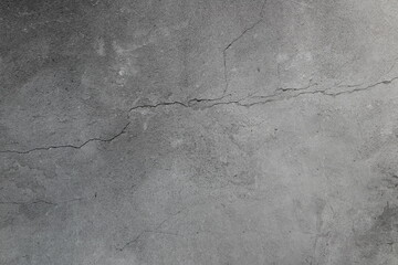 The old crack grey cement wall in the house