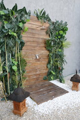 outdoor rain shower with wooden wall