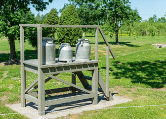 summer landscape with a wooden wooden structure and a milk jug on it, Saaremaa Island, Estonia