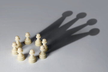 Chess pawn circle with shadow shaped as a crown