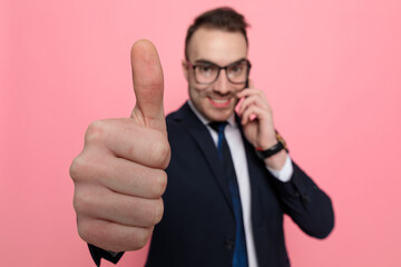 elegant businessman talking on the phone and smiling