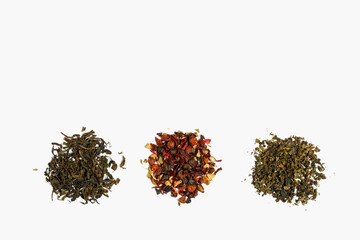 different types of tea scattered on a light gray background. tea shop concept. concept of different tastes and choices. top view, flat lay, copy space.