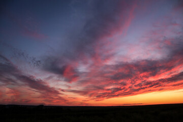 Background of the sky at sunset with purple-pink clouds