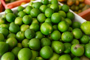 green limes in the fruit market.