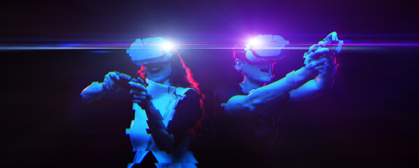 Couple with virtual reality headset are playing game. Image with glitch effect.