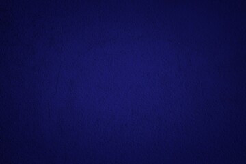 Phantom Blue Concrete Wall Texture Background in Midnight Tone with Lighten Center, Suitable for Wallpaper, Backdrop, Mockup, and Web Design.