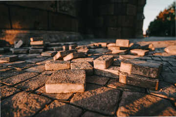 Pieces of street tiles on the stone floor