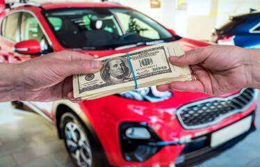 purchase new acr concept. man holding dollar for rent auto
