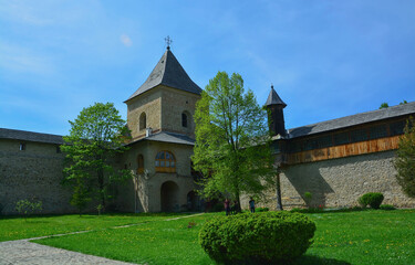 Fototapeta na wymiar SUCEVITE MONASTERY, BUCOVINA, ROMANIA, EUROPE, SPRING 2018. One of the four towers that are inside the stone wall that surrounds the Orthodox monastery. Moldovan architectural style.