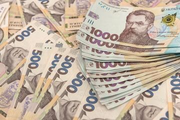 Background of new 1000 500 200 UAH  banknotes on desk. money and save concept. Financial background