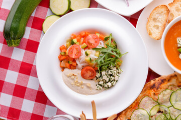 Dietary salad with vegetables, cheese feta, arugula and sauce. Traditional Italian cuisine, Italian concept.