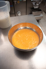 bowl with egg yolks for the preparation of homemade ice cream